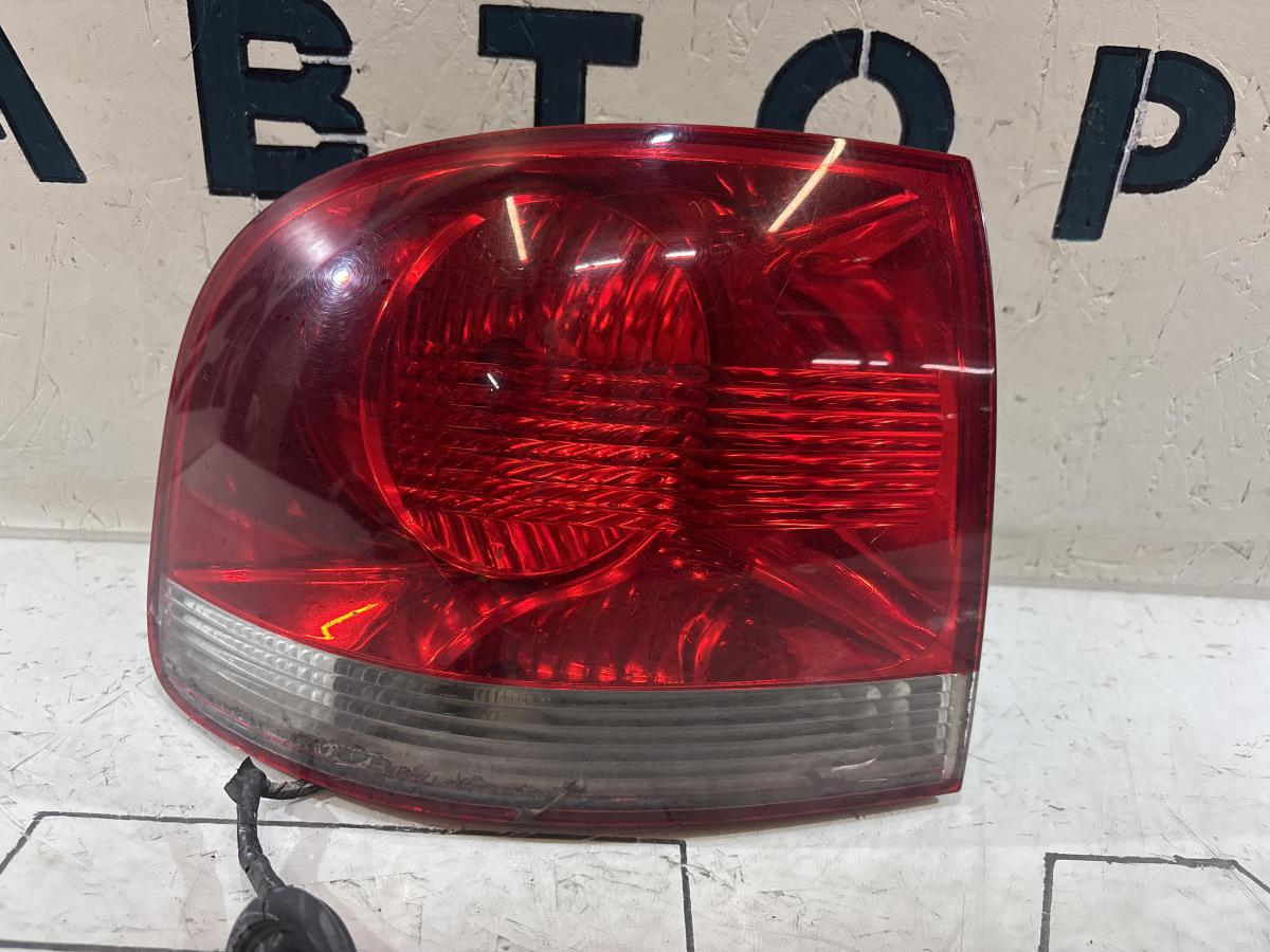 Фонарь левый 7L6945095K Volkswagen Touareg I